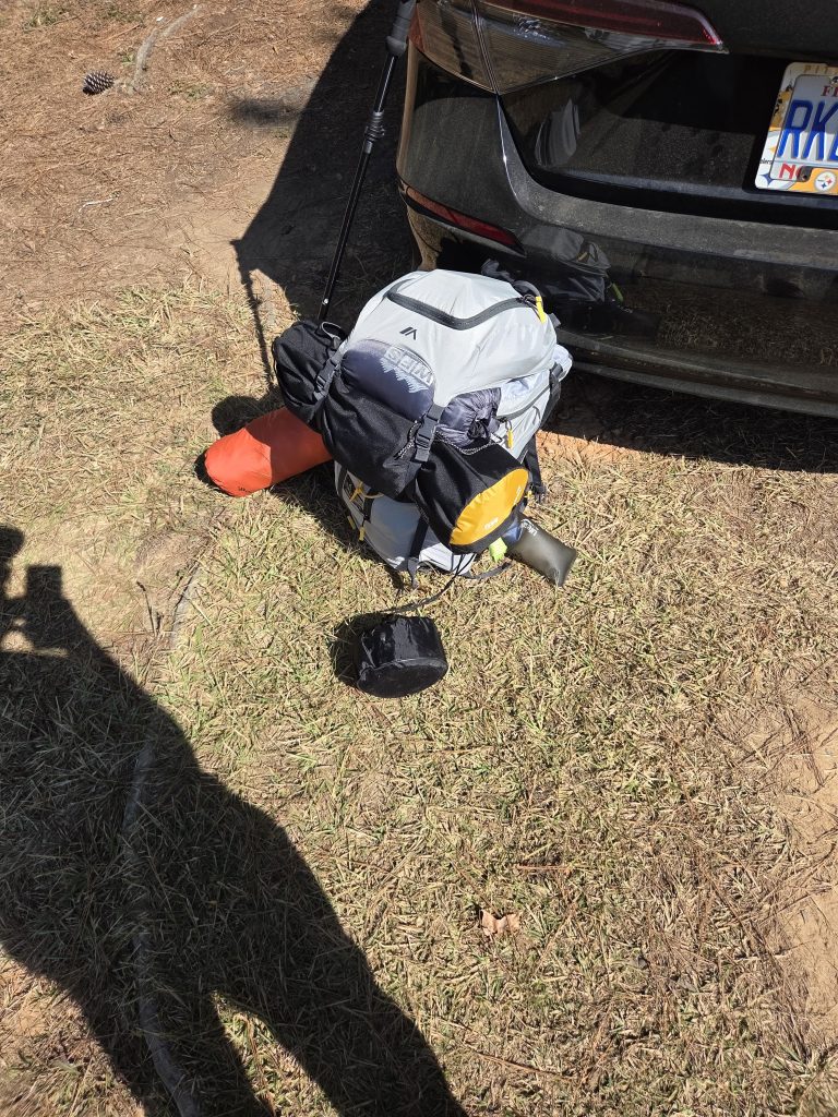 My pack is resting on my car, preparing for the hike.
